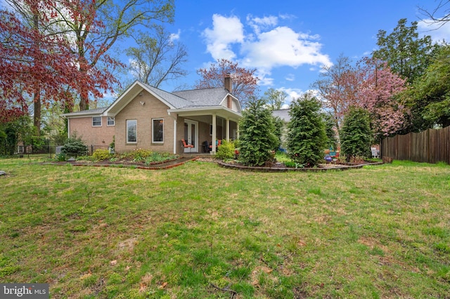 1110 Brantford Ave, Silver Spring, MD 20904 - view of front of property with fence, a chimney, and a front yard