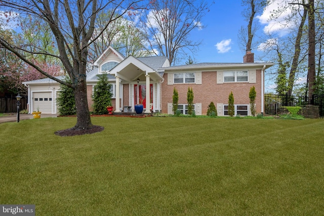 1110 Brantford Ave, Silver Spring, MD 20904 - view of front of house with fence, a front yard, a chimney, brick siding, and an attached garage