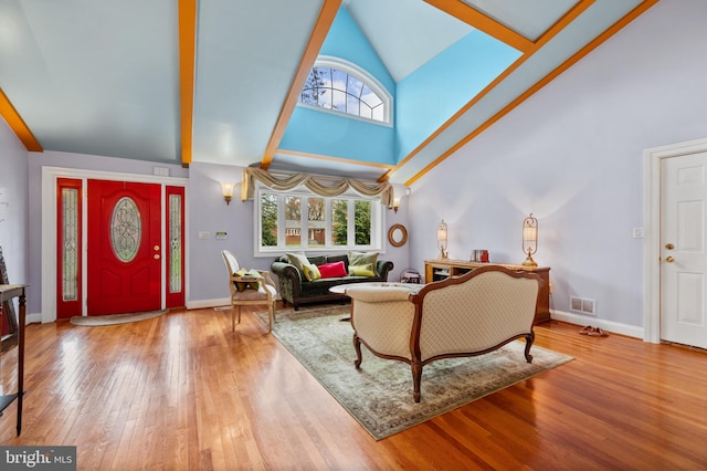 1110 Brantford Ave, Silver Spring, MD 20904 - living room with visible vents, wood finished floors, a healthy amount of sunlight, and high vaulted ceiling