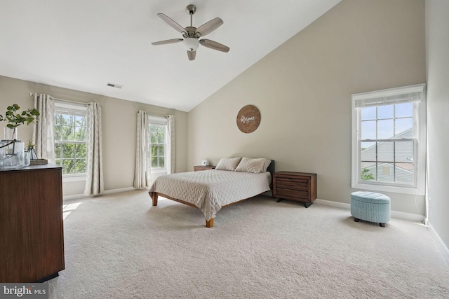 bedroom with visible vents, baseboards, carpet floors, and high vaulted ceiling