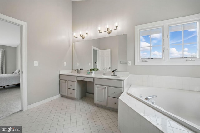bathroom featuring double vanity, baseboards, a sink, and a garden tub