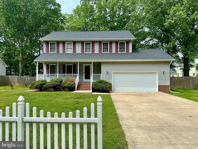 view of front of house featuring a front lawn, fence, covered porch, concrete driveway, and an attached garage