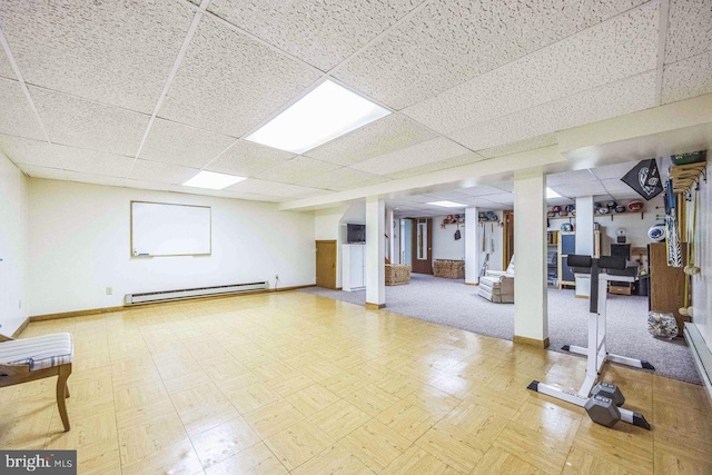 13 Elena Ct, Voorhees, NJ 08043 - finished basement featuring a paneled ceiling, a baseboard radiator, and baseboards