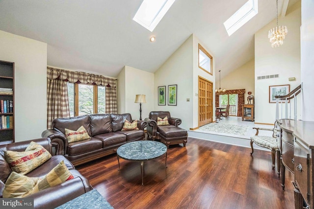 13 Elena Ct, Voorhees, NJ 08043 - living area with a notable chandelier, dark wood-style flooring, a skylight, and high vaulted ceiling