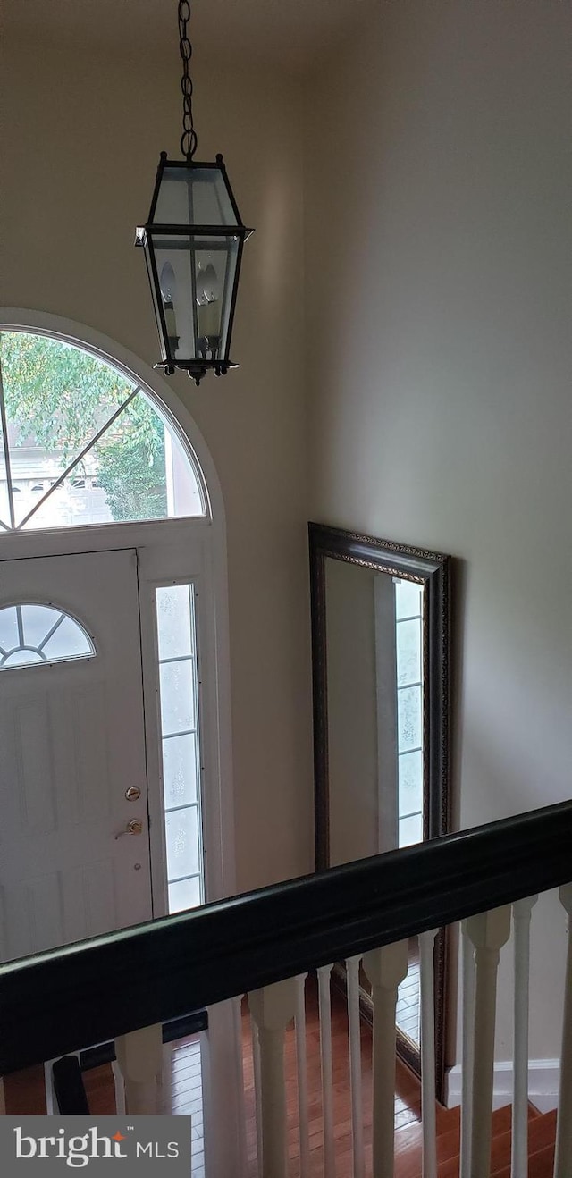 foyer featuring a chandelier