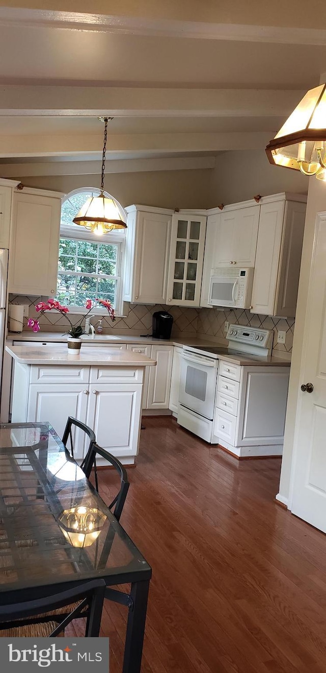 kitchen with decorative backsplash, white cabinetry, beam ceiling, and white appliances