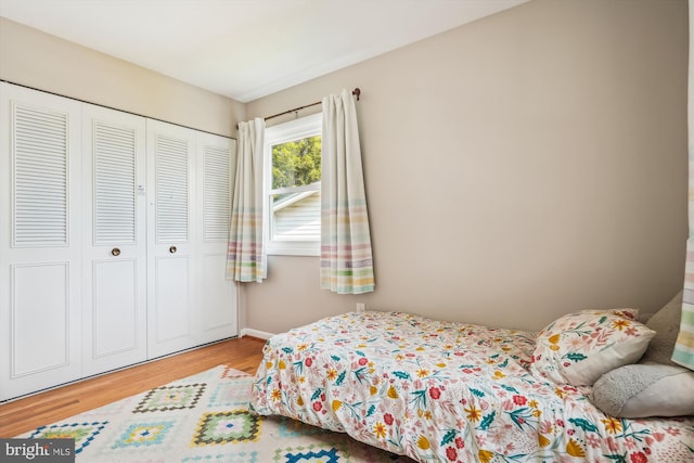 2409 Hayden Dr, Silver Spring, MD 20902 - bedroom featuring wood finished floors, a closet, and baseboards