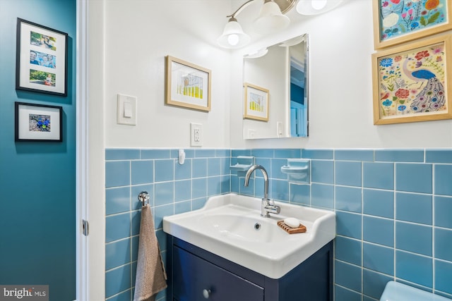 2409 Hayden Dr, Silver Spring, MD 20902 - bathroom featuring vanity, wainscoting, and tile walls