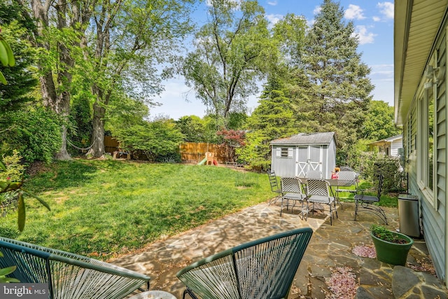 2409 Hayden Dr, Silver Spring, MD 20902 - view of yard featuring a patio area, a storage unit, and an outdoor structure