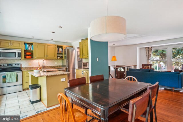 2409 Hayden Dr, Silver Spring, MD 20902 - dining room with recessed lighting and light tile patterned floors