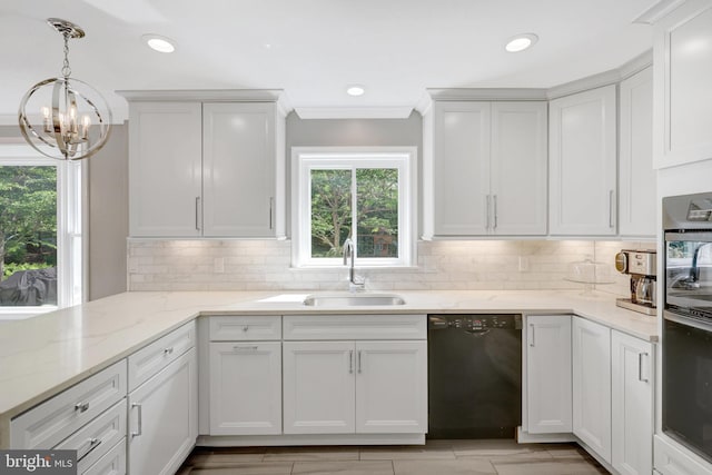 kitchen featuring dishwasher, decorative backsplash, an inviting chandelier, and a sink