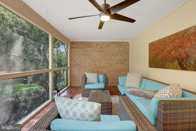 sunroom / solarium featuring an outdoor hangout area and a ceiling fan