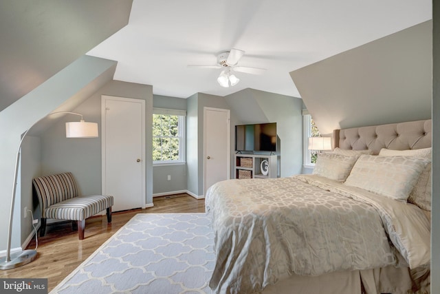 bedroom with wood finished floors, baseboards, and ceiling fan