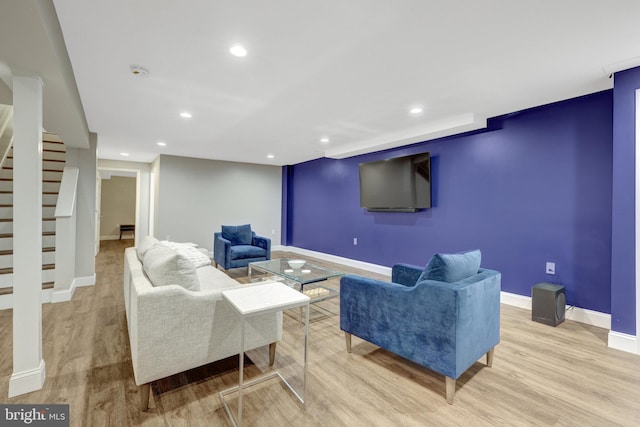 living room with baseboards, stairs, recessed lighting, and wood finished floors