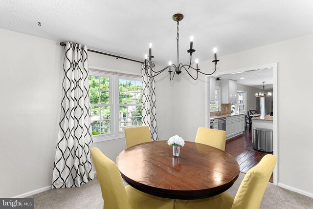 4628 Sand Rock Ln, Chantilly, VA 20151 - dining area featuring baseboards, dark carpet, and a chandelier