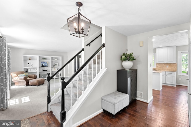 4628 Sand Rock Ln, Chantilly, VA 20151 - staircase with baseboards, visible vents, wood-type flooring, and a notable chandelier