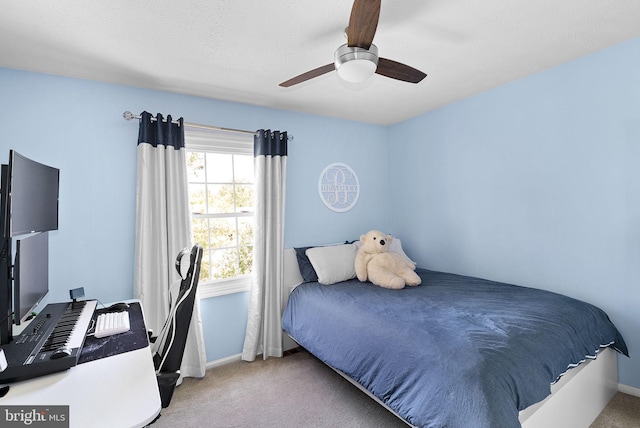 bedroom featuring a ceiling fan, baseboards, and carpet