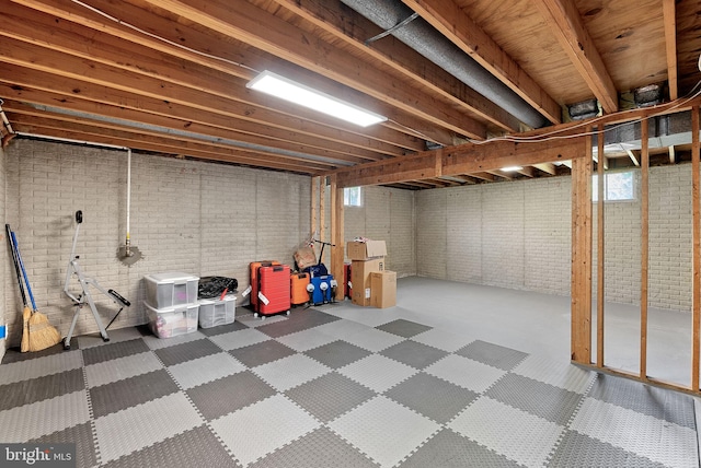 below grade area with brick wall