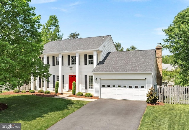 4628 Sand Rock Ln, Chantilly, VA 20151 - greek revival inspired property with a garage, a front lawn, fence, and driveway