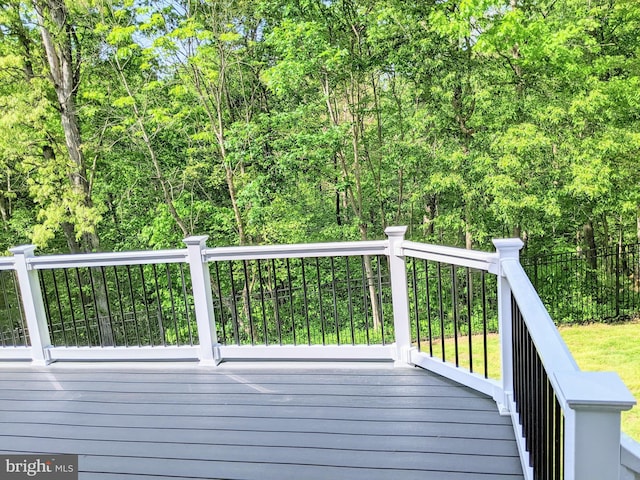 deck featuring a wooded view