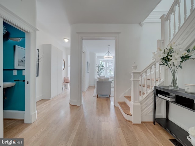 27 Seaton Pl NW, Washington, DC 20001 - foyer entrance featuring stairway, baseboards, light wood-type flooring, and visible vents
