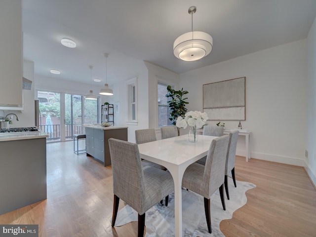 27 Seaton Pl NW, Washington, DC 20001 - dining area with baseboards and light wood finished floors