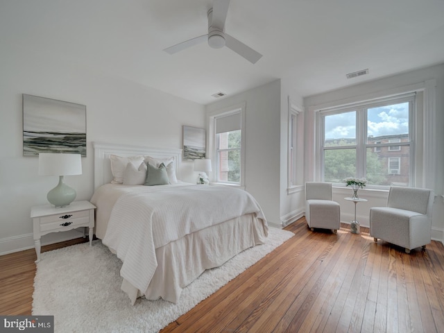 27 Seaton Pl NW, Washington, DC 20001 - bedroom featuring baseboards, visible vents, multiple windows, and hardwood / wood-style flooring