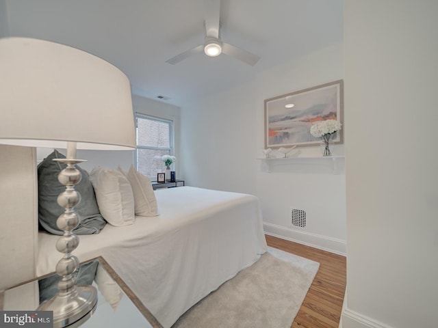 27 Seaton Pl NW, Washington, DC 20001 - bedroom featuring ceiling fan, baseboards, visible vents, and wood finished floors