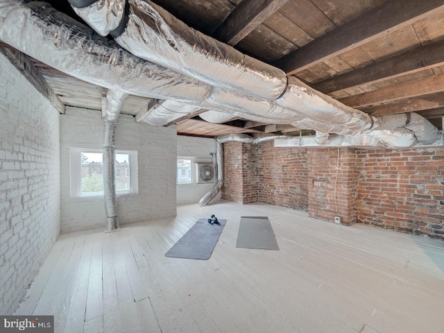 27 Seaton Pl NW, Washington, DC 20001 - basement with brick wall and hardwood / wood-style floors