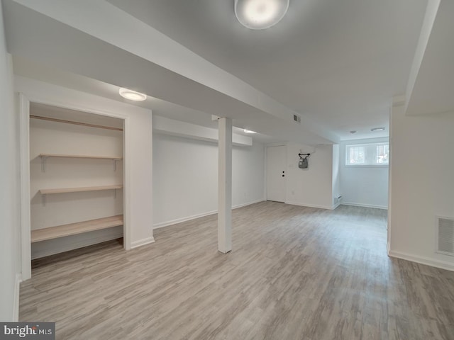 27 Seaton Pl NW, Washington, DC 20001 - basement with baseboards, light wood-style flooring, and visible vents