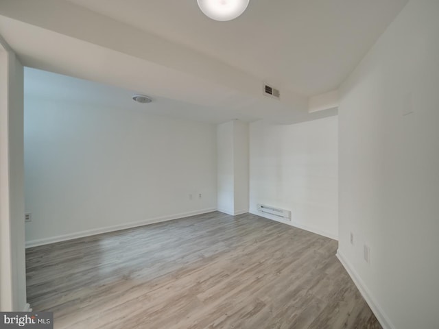27 Seaton Pl NW, Washington, DC 20001 - unfurnished room with visible vents, baseboards, wood finished floors, and baseboard heating