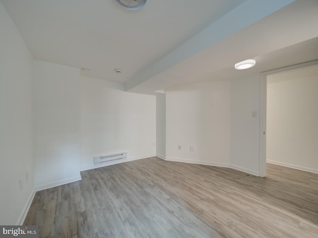 27 Seaton Pl NW, Washington, DC 20001 - empty room featuring baseboards, wood finished floors, and baseboard heating