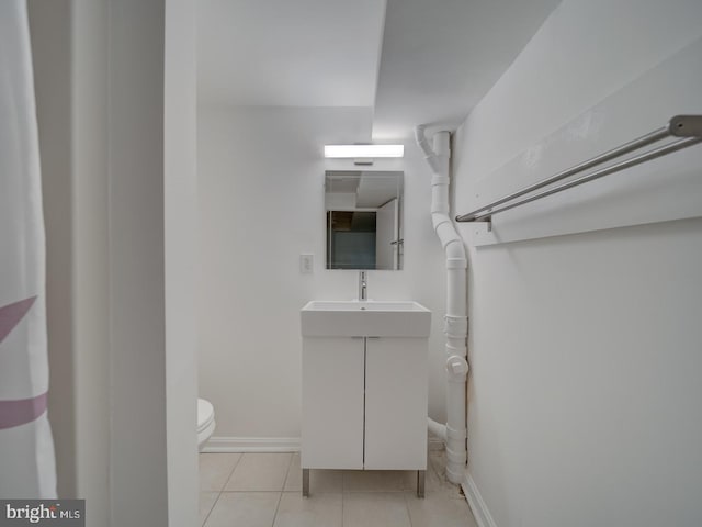 27 Seaton Pl NW, Washington, DC 20001 - half bathroom with toilet, baseboards, tile patterned flooring, and vanity