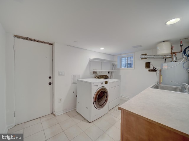 27 Seaton Pl NW, Washington, DC 20001 - laundry area featuring visible vents, a sink, water heater, separate washer and dryer, and recessed lighting