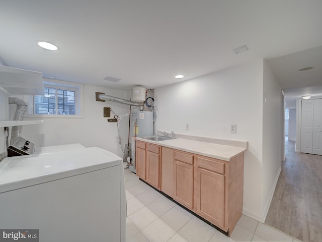 27 Seaton Pl NW, Washington, DC 20001 - laundry area featuring gas water heater, cabinet space, a sink, washer / dryer, and recessed lighting