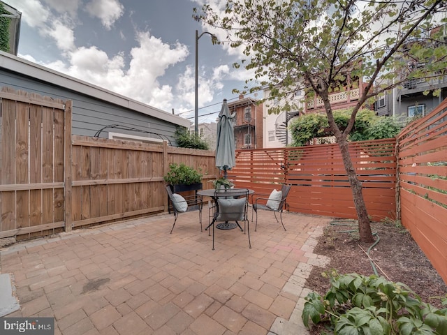 27 Seaton Pl NW, Washington, DC 20001 - view of patio with outdoor dining area and a fenced backyard
