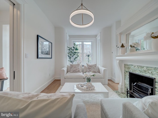 27 Seaton Pl NW, Washington, DC 20001 - living room featuring a fireplace, baseboards, and light wood-type flooring