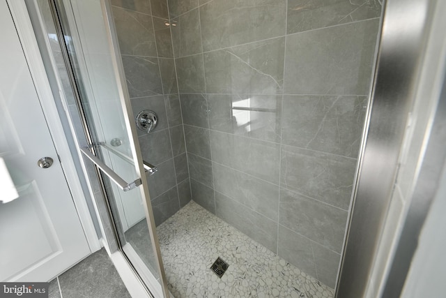 bathroom featuring a shower stall