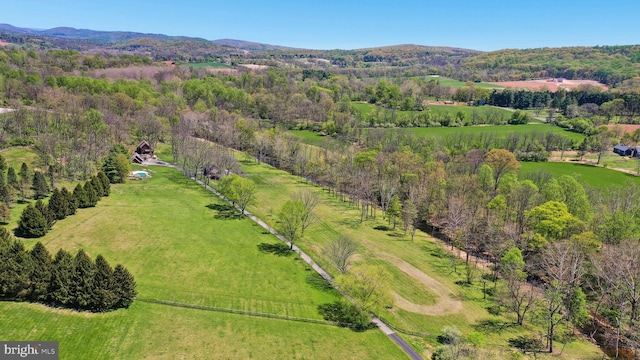 birds eye view of property featuring a mountain view and a rural view