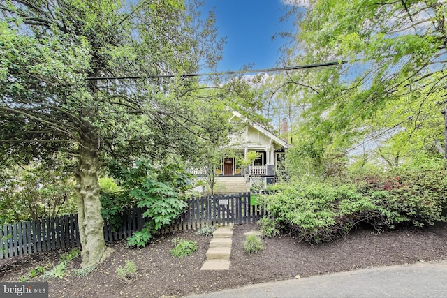 view of front facade with a fenced front yard and covered porch