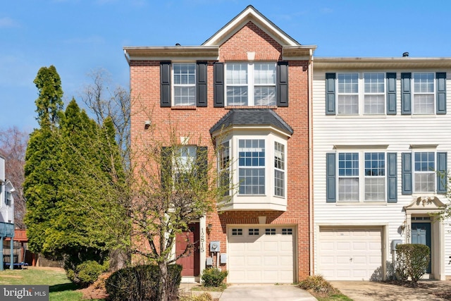 12815 Duck Pond Dr Unit 111, Germantown, MD 20874 - view of property featuring an attached garage, driveway, and brick siding
