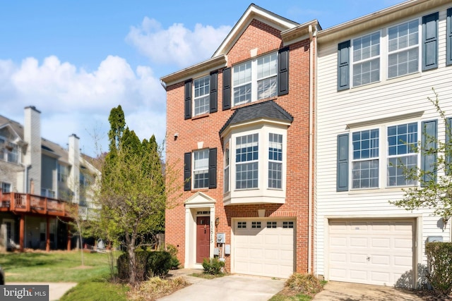 12815 Duck Pond Dr Unit 111, Germantown, MD 20874 - view of property with an attached garage, driveway, and brick siding