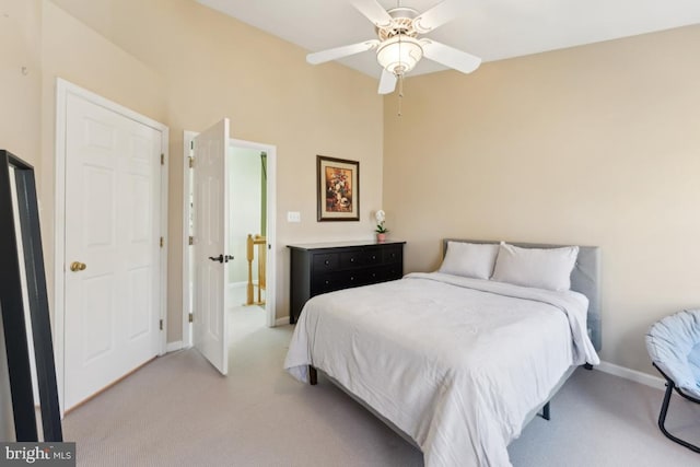 12815 Duck Pond Dr Unit 111, Germantown, MD 20874 - bedroom featuring baseboards, ceiling fan, and light carpet