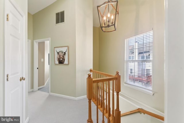 12815 Duck Pond Dr Unit 111, Germantown, MD 20874 - interior space featuring visible vents, an upstairs landing, baseboards, a chandelier, and carpet