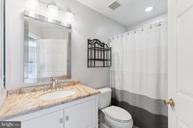 12815 Duck Pond Dr Unit 111, Germantown, MD 20874 - full bath with visible vents, vanity, toilet, a shower with shower curtain, and recessed lighting