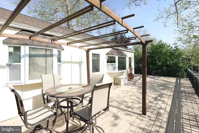 view of patio / terrace featuring a pergola, a wooden deck, and outdoor dining area
