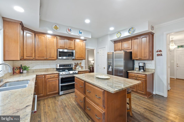 11406 Royal Vw, North Potomac, MD 20878 - kitchen with appliances with stainless steel finishes, a sink, light stone counters, decorative backsplash, and brown cabinetry