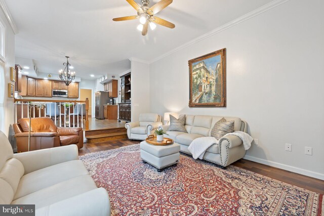 11406 Royal Vw, North Potomac, MD 20878 - living area with a ceiling fan, baseboards, wood finished floors, ornamental molding, and a chandelier