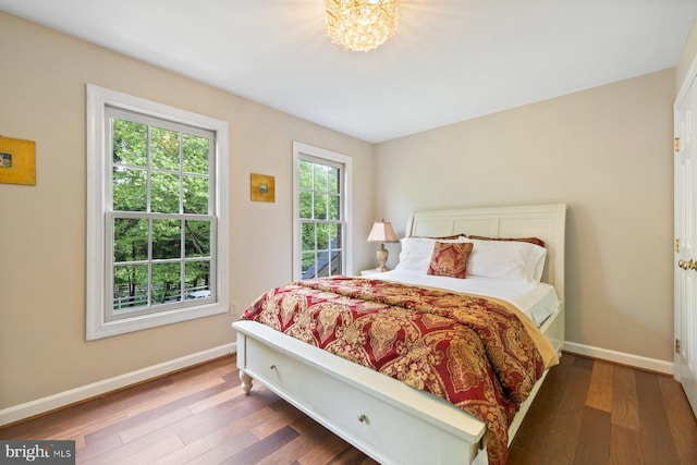11406 Royal Vw, North Potomac, MD 20878 - bedroom featuring wood-type flooring, baseboards, and a chandelier