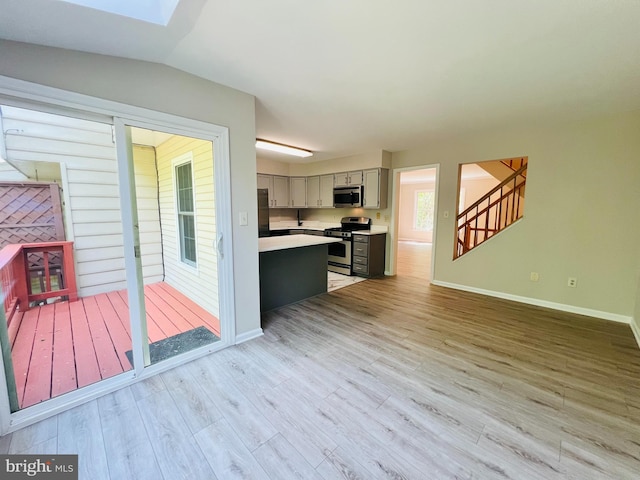 6062 Clay Spur Ct, Centreville, VA 20121 - kitchen featuring appliances with stainless steel finishes, light countertops, light wood finished floors, baseboards, and gray cabinetry